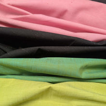 Load image into Gallery viewer, Stack of colorful fabrics including pink, black, green, and yellow. Available at Minerva's Bower