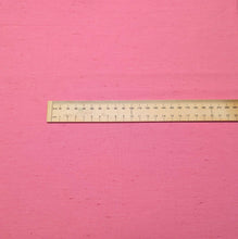 Load image into Gallery viewer, Solid pink colour cotton fabric swatch with a textured pattern. Available at Minerva's Bower. Ruler  included for scale