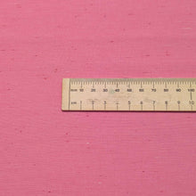 Load image into Gallery viewer, Solid pink colour cotton fabric swatch with a textured pattern. Available at Minerva's Bower. Ruler  included for scale
