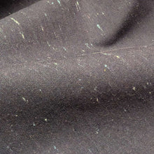 Load image into Gallery viewer, Textured dark grey background cotton fabric with small white specks. Available at Minerva's Bower. Fabric draped to show how it handles