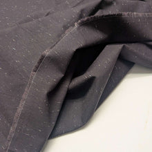 Load image into Gallery viewer, Textured dark grey background cotton fabric with small white specks. Available at Minerva's Bower. Fabric draped to show how it handles