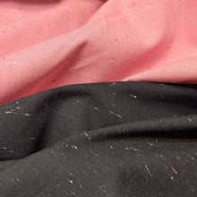 Load image into Gallery viewer, Textured dark grey background cotton fabric with small white specks. Available at Minerva's Bower. Fabric draped to show how it handles. Different colourways lay side by side