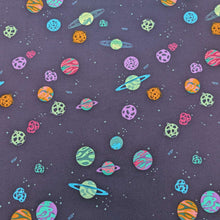 Load image into Gallery viewer, Flat lay of 100% cotton flannelette from Art Gallery Fabrics  with a pattern of colourful planets and stars on a navy base, available at Minerva's Bower