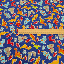 Load image into Gallery viewer, Flat lay of 100% Cotton Poplin, Dinos for sale at Minerva&#39;s Bower, ruler included for scale