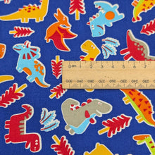Load image into Gallery viewer, Close up flat lay of 100% Cotton Poplin, Dinos for sale at Minerva&#39;s Bower, ruler included for scale