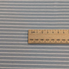 Load image into Gallery viewer, Close up of Whistle Jersey in Powder, stretch cotton jersey in blue with fine white stripe with ruler for scale, for sale at Minerva&#39;s Bower
