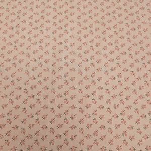 Japanese cotton fabric with a small floral pattern on a soft pink base, for sale at Minerva's Bower