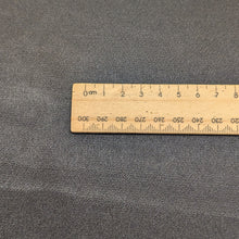 Load image into Gallery viewer, Flat lay of Prom viscose fabric in black. Available at Minerva&#39;s Bower. Ruler included for scale