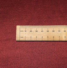 Load image into Gallery viewer, A close-up of a red viscose twill satin fabric surface, our Prom Viscose in Claret. Available at Minerva's Bower. Ruler included for scale