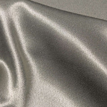 Load image into Gallery viewer, A close-up of a sage viscose twill satin fabric, Prom Viscose in Lichen. Available at Minerva's Bower. Ruler included for scale