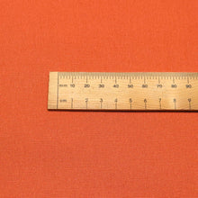 Load image into Gallery viewer, Close up flat lay of Quackers 100% Cotton Duck, Orange, ruler included - for sale at Minerva's Bower