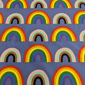 Alexander Henry cotton Fabric with rainbow pattern on a blue background, for sale at Minerva's Bower