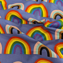 Load image into Gallery viewer, Drape of Alexander Henry cotton Fabric with rainbow pattern on a blue background, for sale at Minerva&#39;s Bower