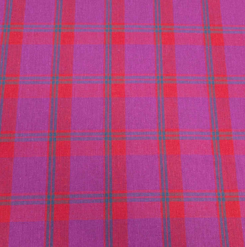 Flat lay of linen cotton Raspberry Plaid in red, pink and purple. Available at Minerva's Bower