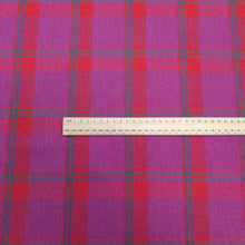 Load image into Gallery viewer, Flat lay of linen cotton Raspberry Plaid in red, pink and purple. Available at Minerva&#39;s Bower. Ruler included for scale