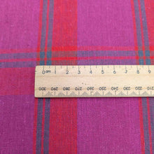 Load image into Gallery viewer, Flat lay of linen cotton Raspberry Plaid in red, pink and purple. Available at Minerva&#39;s Bower. Ruler included for scale