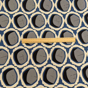 Rayon with circular grey and black shapes and blue and cream accents, for sale at Minerva's Bower, ruler included for scale