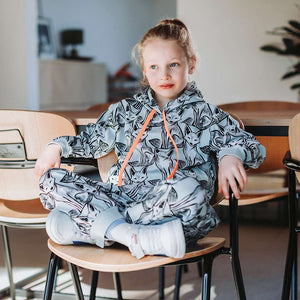 Child in tracksuit in See You At Six Cotton French Terry, Renard Nouveau, fabric for sale at Minerva's Bower