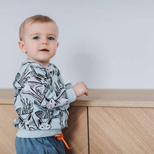 Load image into Gallery viewer, Child in tracksuit in See You At Six Cotton French Terry, Renard Nouveau, fabric for sale at Minerva&#39;s Bower