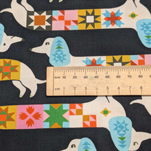 Load image into Gallery viewer, Close up flat lay of Ruby Star 100% Cotton, 1-800-Notion Quilty Dog, ruler included for scale- for sale at 
Minerva's Bower