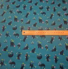 Load image into Gallery viewer, Pattern of black cats with flowers on a teal cotton Ruby Star Society fabric background. Made in Japan. Available at Minerva's Bower. Ruler included for scale