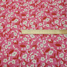 Load image into Gallery viewer, Floral pattern with red and white flowers on a pink cotton background. Made in Japan. Available at Minerva's Bower. Ruler included for scale