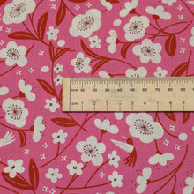 Load image into Gallery viewer, Floral pattern with red and white flowers on a pink cotton background. Made in Japan. Available at Minerva's Bower. Ruler included for scale