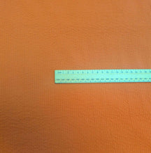 Load image into Gallery viewer, Flat lay of 100% Cotton Seersucker, Terracotta, for sale at Minerva's Bower, ruler included for scale
