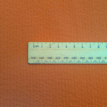 Load image into Gallery viewer, Close up Flat lay of 100% Cotton Seersucker, Terracotta, for sale at Minerva's Bower, ruler included for scale