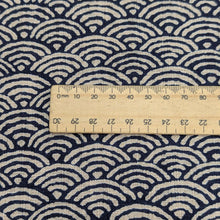 Load image into Gallery viewer, Close up of Japanese 100% cotton Indigo fabric with traditional wave design, for sale at Minervas Bower and a ruler included for scale 