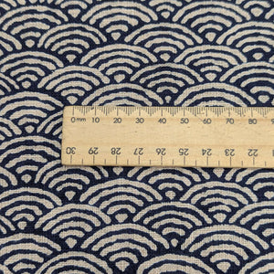 Close up of Japanese 100% cotton Indigo fabric with traditional wave design, for sale at Minervas Bower and a ruler included for scale 