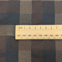 Load image into Gallery viewer, Close up of Yarn dyed 30% linen 70% cotton blend plaid check in brown, blue and purple available at Minerva&#39;s Bower, with ruler included for scale