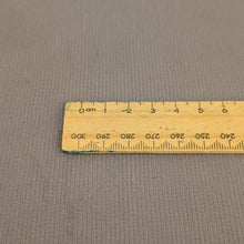 Load image into Gallery viewer, Close up flat lay of 14 wale Sonny 97% cotton 3% elastane Cord, Dove , ruler included for scale - for sale at Minerva's Bower