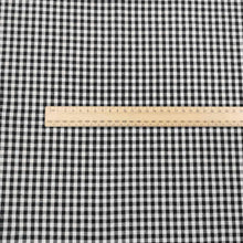 Load image into Gallery viewer, Flat lay of Spencer cotton linen check in black. Available at Minerva&#39;s Bower. Ruler included for scale