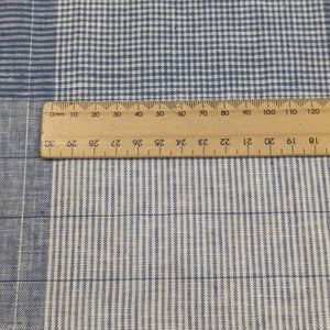 Close up of Blue and white checkered linen cotton fabric for sale at Minerva's Bower, with ruler for scale