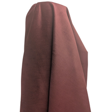 Load image into Gallery viewer, Close-up of a claret pinwale corduroy fabric surface. Available at Minerva's Bower. Fabric draped to show how it hangs