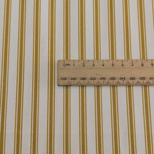 Load image into Gallery viewer, Close up flat lay of 100% Cotton Canvas Ticking Stripe, Mustard, for sale at Minerva's Bower, ruler included for scale