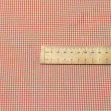 Load image into Gallery viewer, Close up flat lay of yarn dyed Japanese 100% Cotton, Tiny Gingham Orange, ruler included for scale - for sale at Minerva's Bower