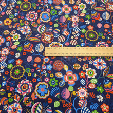 Load image into Gallery viewer, Flat lay of Thread and Ink 100% Cotton, Tree Flower Navy Blue cloth with vibrant multicolour retro floral design, ruler included for scale - for sale at Minerva's Bower