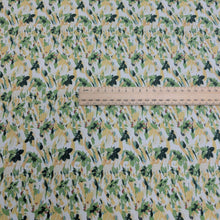 Load image into Gallery viewer, Japanese cotton fabric with a floral pattern with small flowers in greens and yellows,  with ruler included for scale, for sale at Minerva&#39;s Bower
