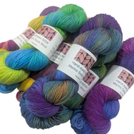Hand-dyed merino sock wool yarn in various colors with labels on a white background