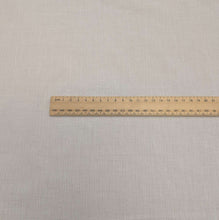 Load image into Gallery viewer, Japanese wased cotton gauze in white with a faint self stripe, for sale at Minerva's Bower, ruler included for scale