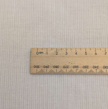 Load image into Gallery viewer, Close up of Japanese wased cotton gauze in white with a faint self stripe, for sale at Minerva's Bower, ruler included for scale