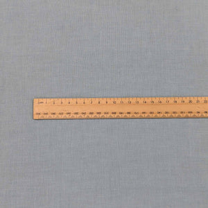 Flat lay of bella linen cotton in spring blue. Available at Minerva's Bower. Ruler included for scale