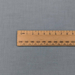 Flat lay of bella linen cotton in spring blue. Available at Minerva's Bower. Ruler included for scale