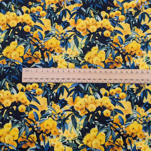 Flat lay of Devonstone cotton in Wattle. Available at Minerva's Bower. Ruler included for scale