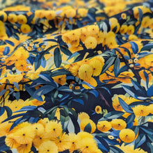 Load image into Gallery viewer, Flat lay of Devonstone cotton in Wattle. Available at Minerva&#39;s Bower. Fabric draped to show how it handles