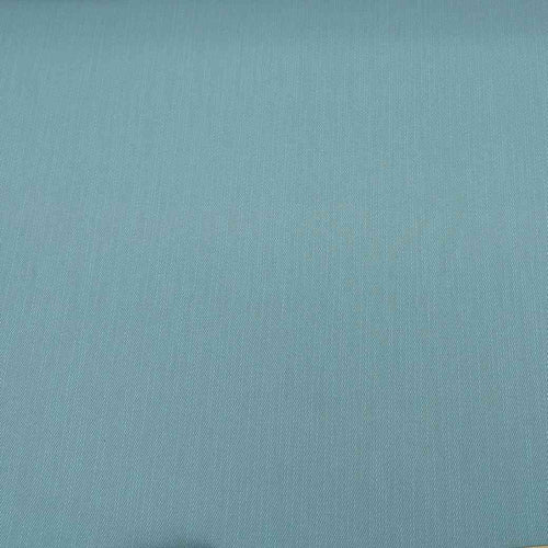 Flat lay of cotton denim, in duck egg colourway. Available at Minerva's Bower