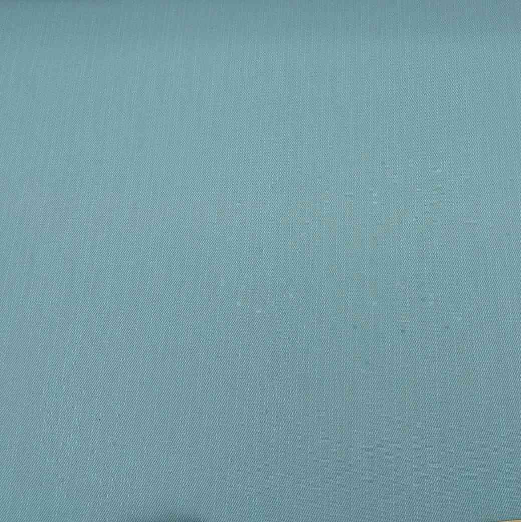 Flat lay of cotton denim, in duck egg colourway. Available at Minerva's Bower