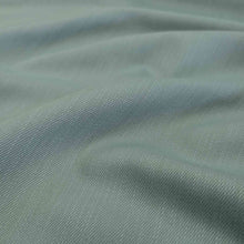 Load image into Gallery viewer, Flat lay of cotton denim, in duck egg colourway. Available at Minerva&#39;s Bower. FAbric draped to show how it handles